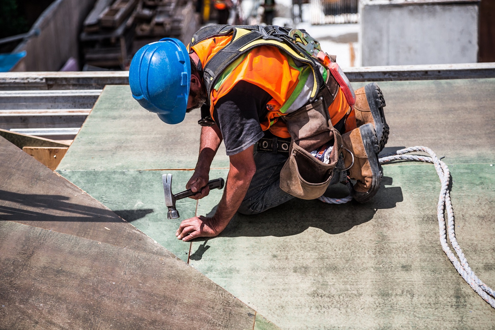 CSCS Construction Safety - Green Card - construction worker showing working on a roof