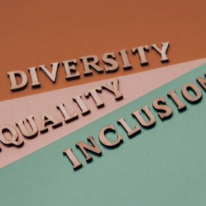 Graphic with rose, pink and sage green splashes with wooden letters spelling out: DIVERSITY, EQUALITY and INCLUSION