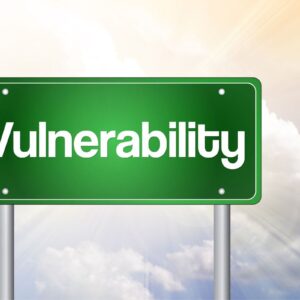 Green road sign displaying 'Vulnerability' in front of a cloud background