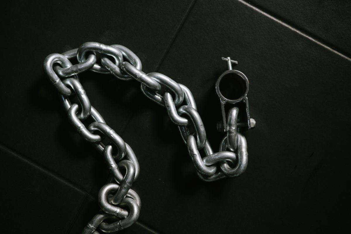 Chain rope laid on a black background