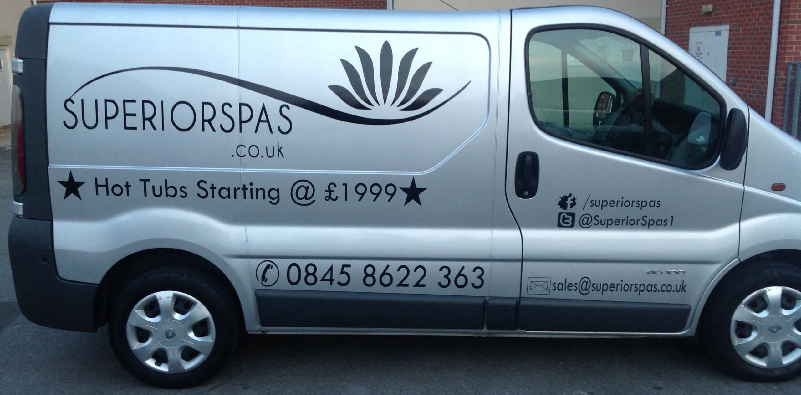 Side of Superior Spas sign written Van